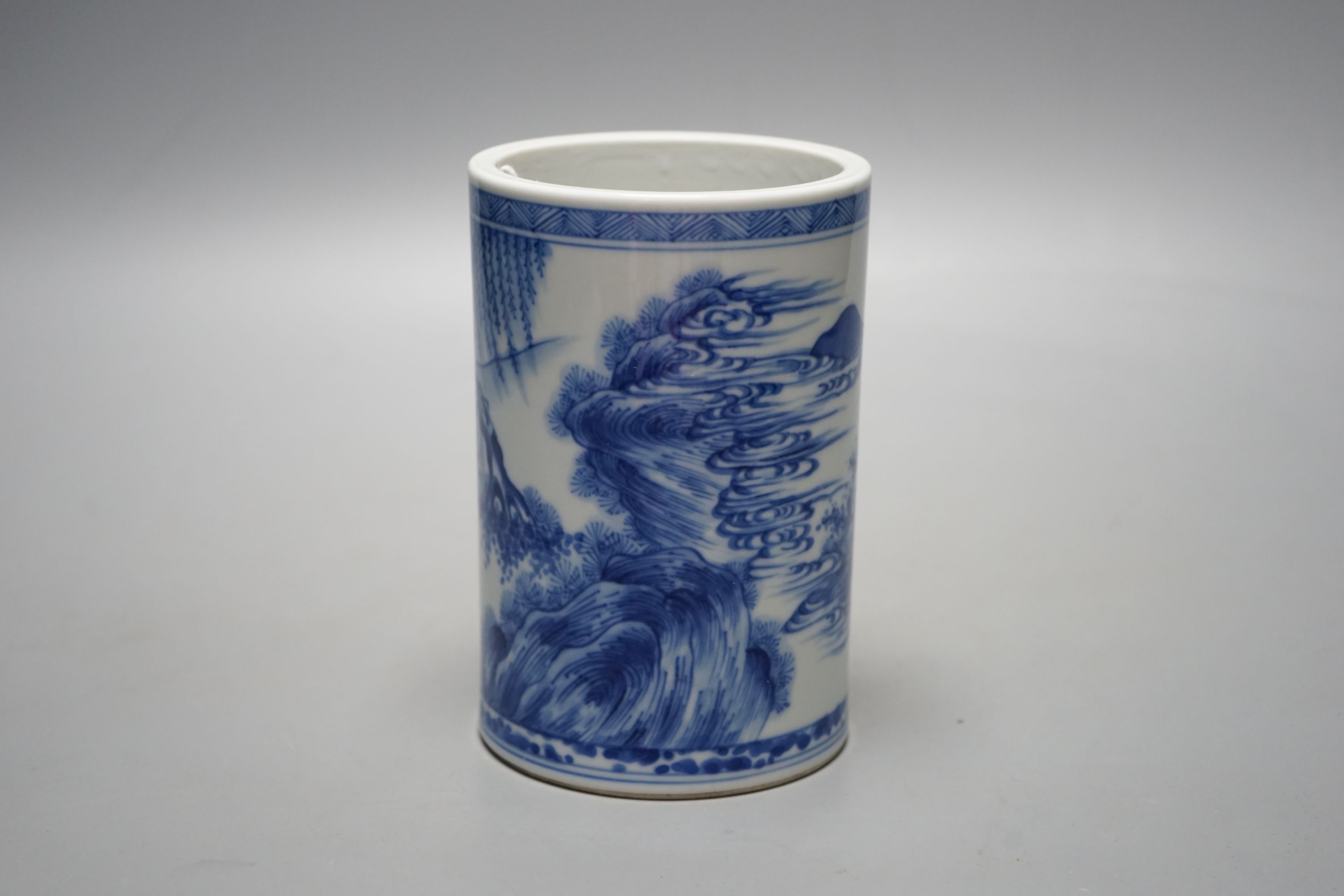 A Chinese blue and white brush pot, 14 cms high.